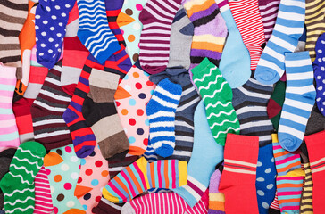 Different multicolored bright socks. Abstract background image.