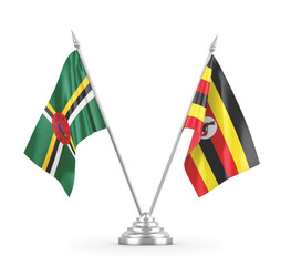 Uganda and Dominica table flags isolated on white 3D rendering