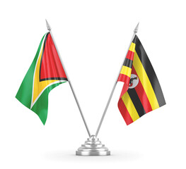 Uganda and Guyana table flags isolated on white 3D rendering