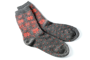Pair of grey wool socks with orange pattern isolated on white