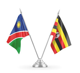 Uganda and Namibia table flags isolated on white 3D rendering