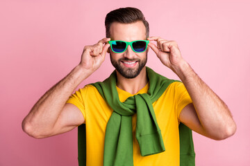 Photo of young man hold hands wear sunglass tight jumper good mood isolated on pink color background