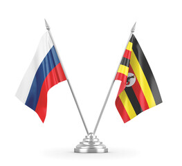 Uganda and Russia table flags isolated on white 3D rendering