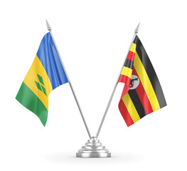 Uganda and Saint Vincent and the Grenadines table flags isolated on white