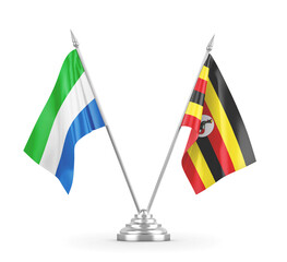 Uganda and Sierra Leone table flags isolated on white 3D rendering