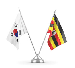 Uganda and South Korea table flags isolated on white 3D rendering