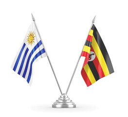Uganda and Uruguay table flags isolated on white 3D rendering