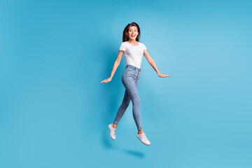 Full size profile side photo of amazed girl jump up air shocked discount isolated on pastel blue color background