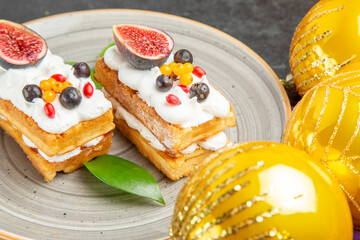 front view yummy waffle cakes with fruits on the dark background photo cream sugar dessert cake sweet