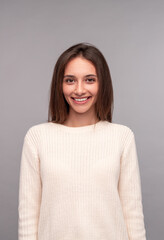Fototapeta premium Cheerful young woman smiling for camera
