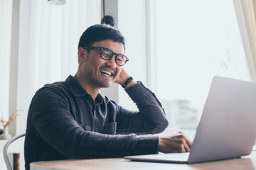 man work using computer hand typing laptop keyboard contact us online chatting search form internet sitting at office.concept for technology device communication business people