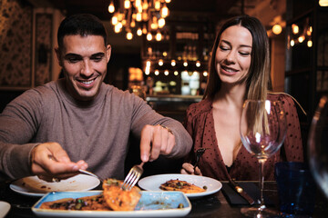 Young couple on a date at the restaurant.