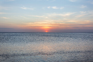 Calm sea with sunset sky. Meditation ocean and sky background. Tranquil seascape. Horizon over the water