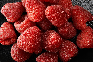 Close up of fresh and juicy raspberries filling the frame.