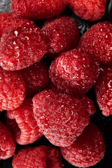 Close up of fresh and juicy raspberries filling the frame.