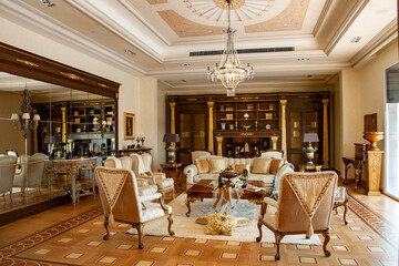 Showroom exhibited modern production furniture in classical period style arranged in a lavishly decorated interiors.