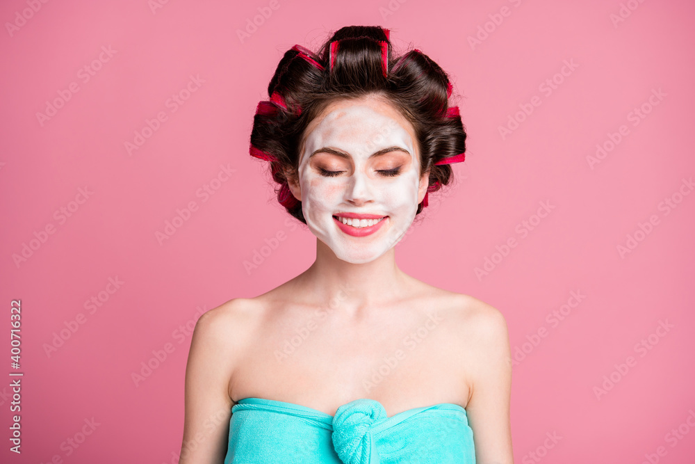 Wall mural Close-up portrait of pretty dreamy cheery housewife wearing mousse on face lift procedure isolated on pink color background