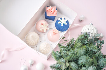 Merry Christmas card. Variety of sweet delicious cakes. Fir branches on a gray background. Merry Christmas card. New year mood