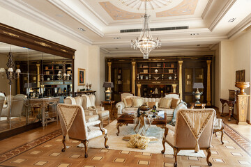 Showroom exhibited modern production furniture in classical period style arranged in a lavishly decorated interiors.