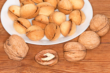 Nuts shape cookies with caramel filling, real walnuts, close-up