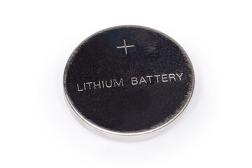 Lithium button battery on a white background close-up