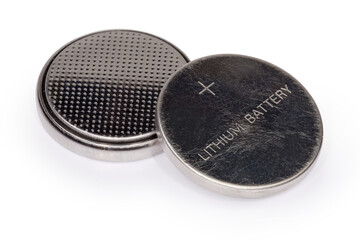 Two lithium button batteries on a white background close-up