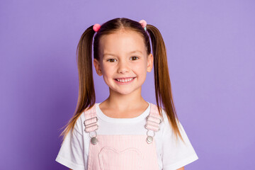 Photo of cute happy brunette little girl charming smile good mood isolated on purple color...