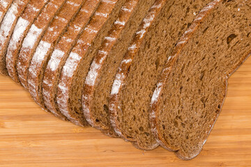 Slices of wheat rye brown bread close-up