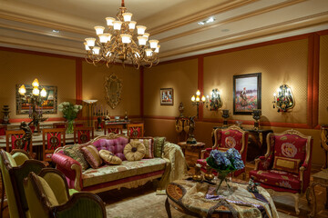 Showroom exhibited modern production furniture in classical period style arranged in a lavishly decorated interiors.