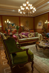 Showroom exhibited modern production furniture in classical period style arranged in a lavishly decorated interiors.