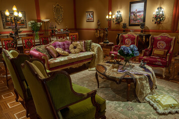 Showroom exhibited modern production furniture in classical period style arranged in a lavishly decorated interiors.