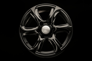 matte black alloy wheel, close-up front view. Powerful wheel for off-road vehicles