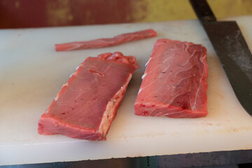Tuna chunks on a cutting board