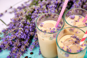 Summer drink iced coffee with lavender in glass