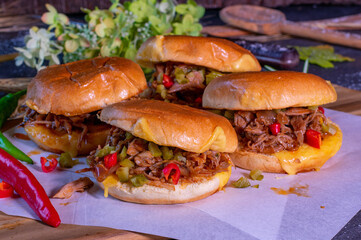 Pulled pork burger served on kitchen table