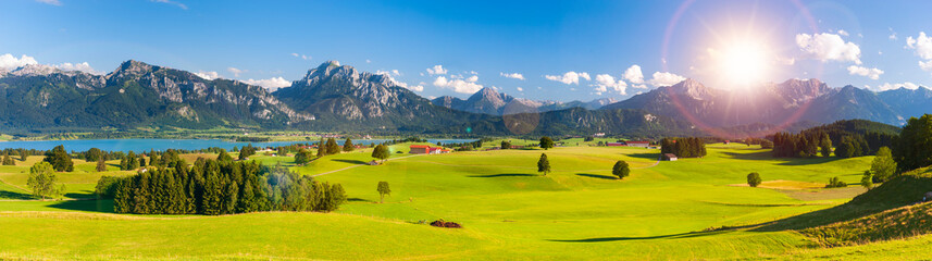 panoramic landscape in Bavaria with mountains and meadow at springtime