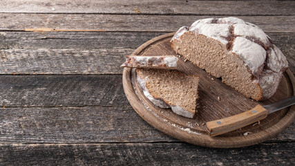 Homemade bread loaves on a wooden board. Text space