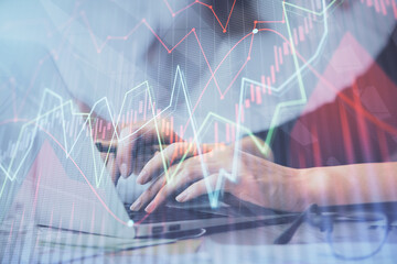 Multi exposure of woman hands typing on computer and financial graph hologram drawing. Stock market analysis concept.