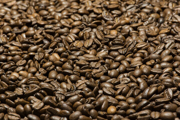 Fresh coffee beans. Roasted coffee. Coffee close up. Coffee texture.
