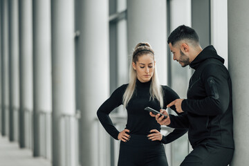 Couch using mobile phone, showing something.