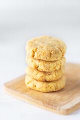 Homemade cookies in a stack on a wooden board. Sugar, gluten, lactose free.
