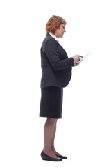 Profile view of aged woman holding tablet and looking at screen with satisfied face