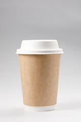 Takeaway coffee cup with lid. Isolated on a white background. Close-up.