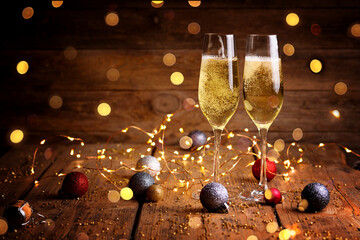 Merry Christmas and Happy New Year Party Background  -  Two glasses of sparkling wine or champagne...