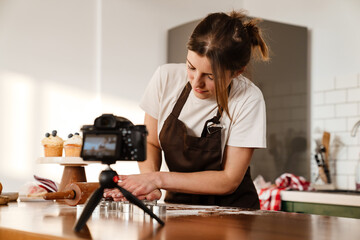 Camera footage of baker woman making Christmas cookies at home kitchen