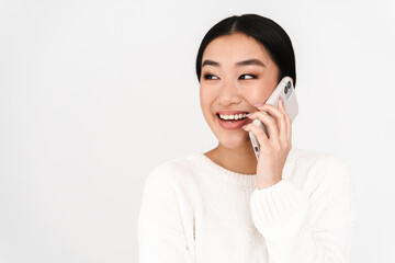 Asian laughing nice girl laughing while talking on mobile phone