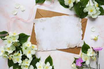 postcard layout. spring composition. floral frame made of  branches, envelope and space for text. congratulation. invitation