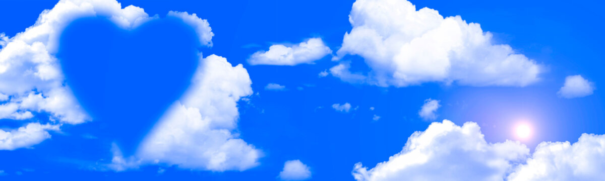 House shape in clouds concept on a bright blue sky day panoramic