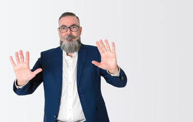 man with wide beard glasses and blue jacket on white background and copy space, raising hands and showing palms,