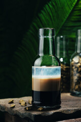 B-52 - layered cocktail with three liqueurs Kahlua, Baileys, Cointreau served in a small bottle.